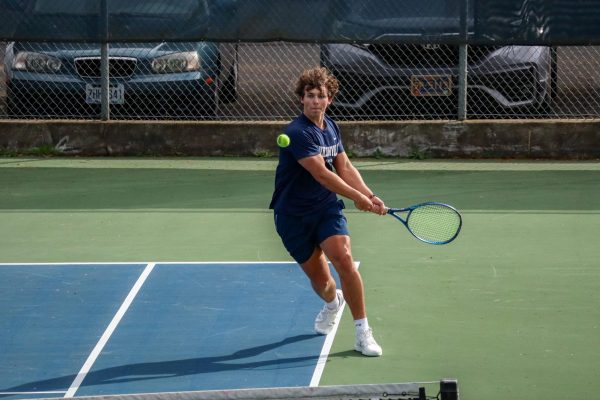 Senior JJ Bartlett blasts a return.  Bartlett has stepped up to be a leader on this year's squad. 