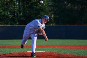 Junior pitcher Colby Kosderka throws out a pitch early into his start. Kosderka's a first year varsity player who's been on a heater from the bump.