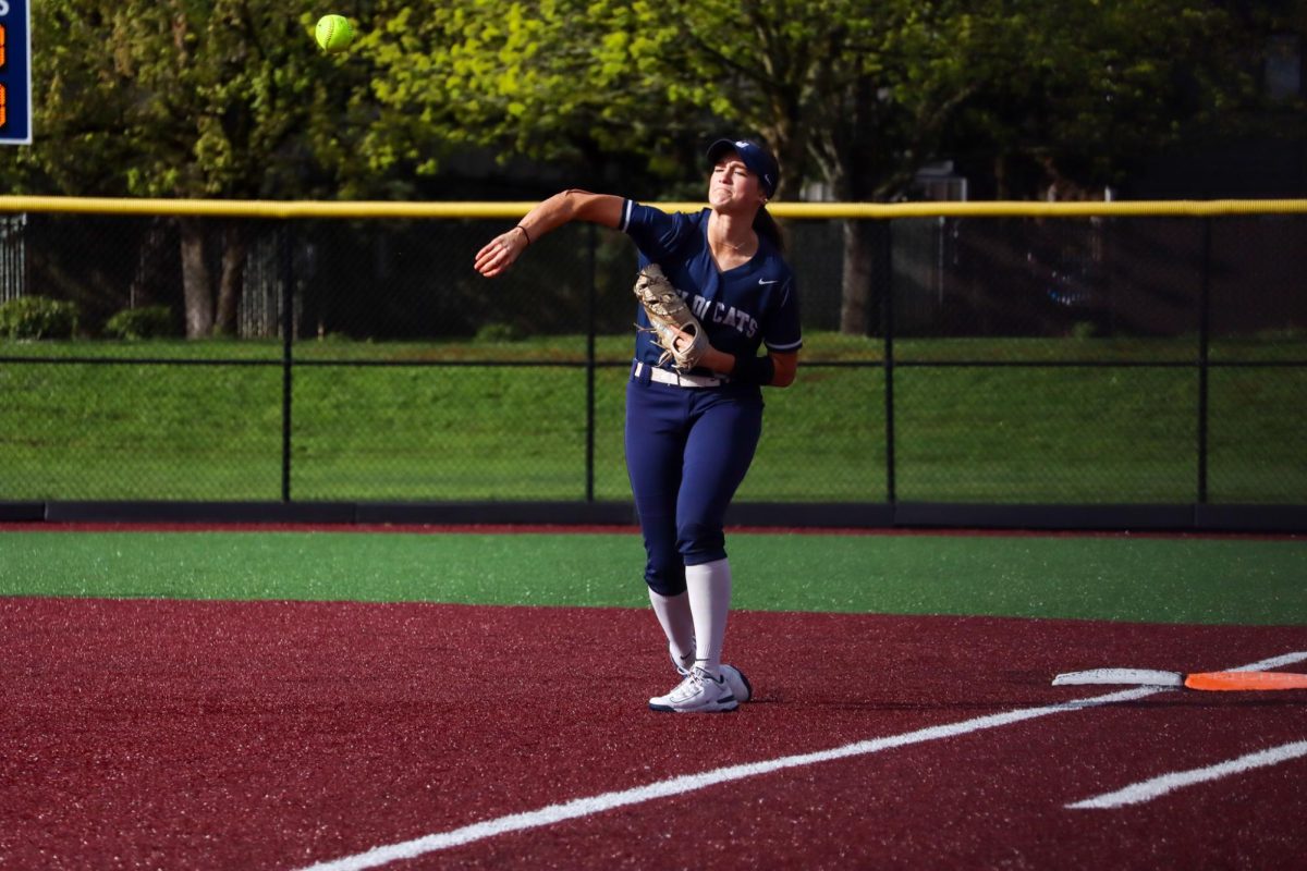 Sophomore Shae Seber made a throw to third base after getting an out at first base. Seber has developed a strong arm and she uses it to make valuable plays during the game. 