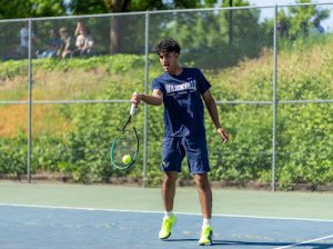 Senior leader Aria Azii Dueling on senior night portraying the skill and growth of the fun compelling game of tennis. Wilsonvillle boys tennis has improved meet by meet this season.