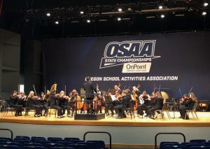 Wilsonville High School’s chamber orchestra performing at state in May 2023, where they placed 7th among the state's most prestigious 6A orchestras. While the competitive OSAA model can promote learning, there is plenty of baggage that comes with competition in a music setting. Photo taken by Morgan Wonderly.