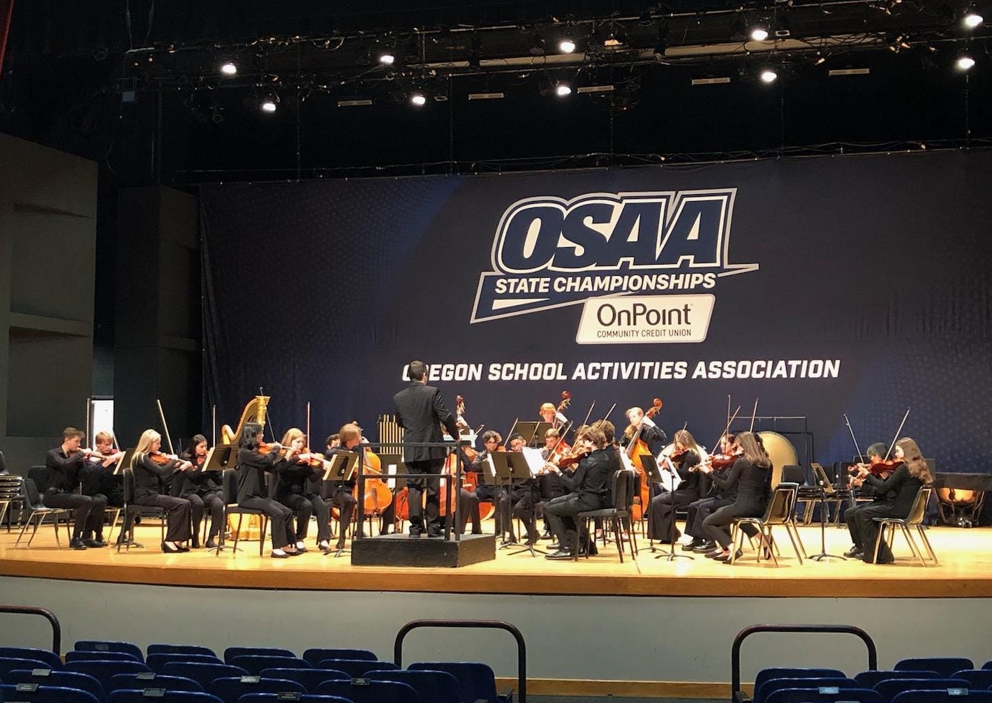 Wilsonville High School’s chamber orchestra performing at state in May 2023, where they placed 7th among the state's most prestigious 6A orchestras. While the competitive OSAA model can promote learning, there is plenty of baggage that comes with competition in a music setting. Photo taken by Morgan Wonderly.