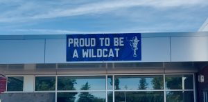 "Proud to be a Wildcat" is a banner that has hung symbolically above the back entrance into Wilsonville High School. Unwavering, the words stand as a constant reminder to all who enter that Wilsonville is a family, and will face trials as one. 