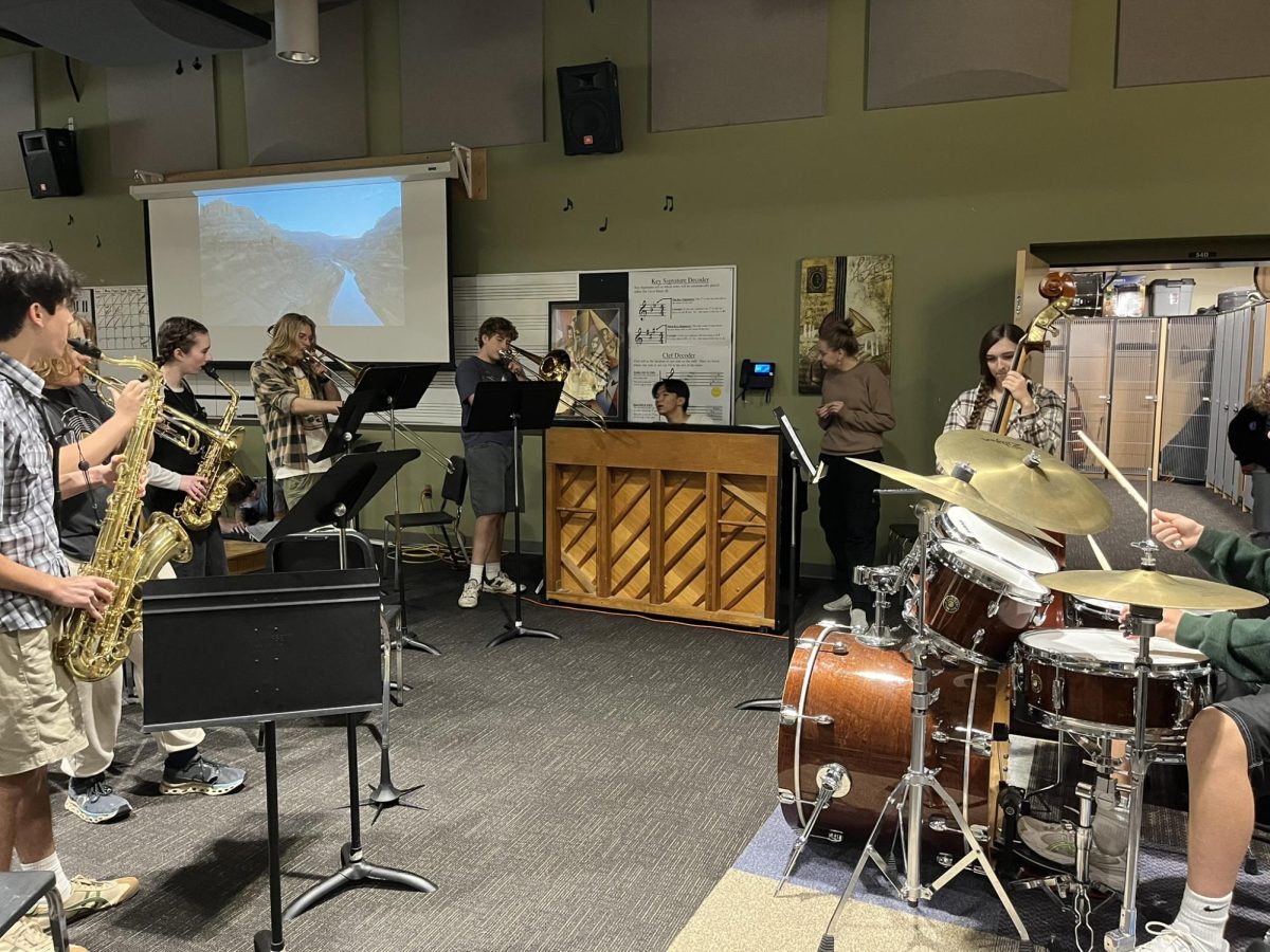 Jazz club members circle up and groove with one another, the combined effort of piano, drums, trumpet, cello, scatting, and more. Inspiration drawn from the riff of the day, but also the beat within their bodies.  