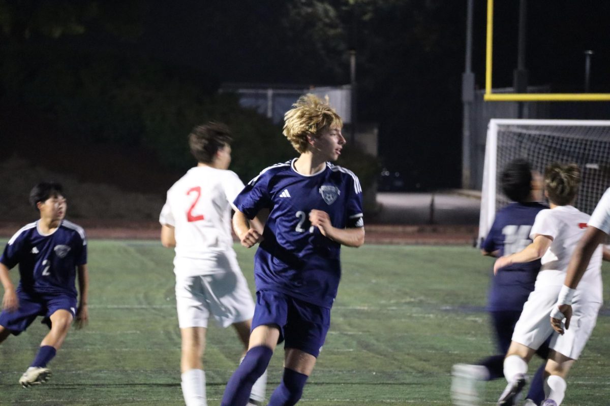 #21, Layne Wettstein runs down the field looking for the opportunity to score a goal. Wettstein, a senior at Wilsonville who has a total of 3 goals this season