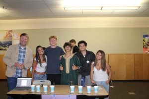 Students Liam Wilde, Norah Arthur, Ayoub Laouamri, Ari Avila Escobar, and Teacher Mr. Deeder stand next to Cultural Exploration club participant Owen Feinblatt. Owen notes, "I hope to spread awareness of cultural similarities, and differences, and in general goodwill among my classmates."
