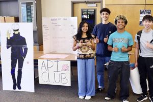 API Club Members stand in front of their table at the club fair with a Gojo board. They gave out candy, stickers, and had students sign up for their Labubu raffle.
Pictured from left to right: Niyati Bhaskar, Thorin Hepburn, Cayden Bautista, Joshua Paris