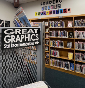 This picture captures part of the teen's graphic novel section at Wilsonville's Public Library. This section features a wide variety of graphic novels, including 2 bookshelf's worth of manga! On the adjacent side of that grey shelf, one can find the promised staff recommendations. 
