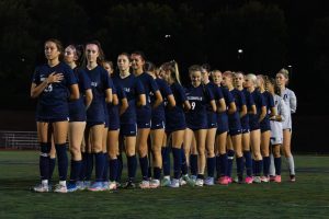 Wilsonville High School Girls soccer team is lined up for the national anthem before their game against Beaverton.
