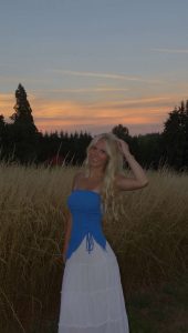 Marley Hartgraves posing for a picture during the sunset. 