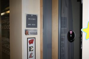 A picture of Mrs. Giese with a welcome stand resides in front of her college and career room. Her room is located right across from the office.