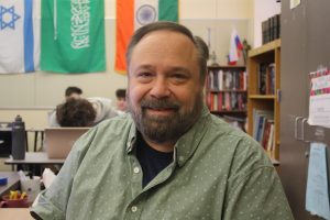 Mr. Eby in his classroom. Here, he teaches a variety of classes and hosts clubs. This includes teaching AP U.S. Government and History Through Film, and extracurriculars Model UN and Jewish Student Union.
