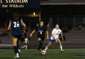 Wilsonville's sophomore star Lyla Johnson passing the ball to one of her team mates on the way to score a goal. Johnson has been on varsity since her freshman year.
