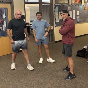 The coaches pose in between heated film discussions. Finck loves Christopher Nolan, but Barkley prefers older movies like The Goonies and Lawrence of Arabia. (Robbie Osborn)
