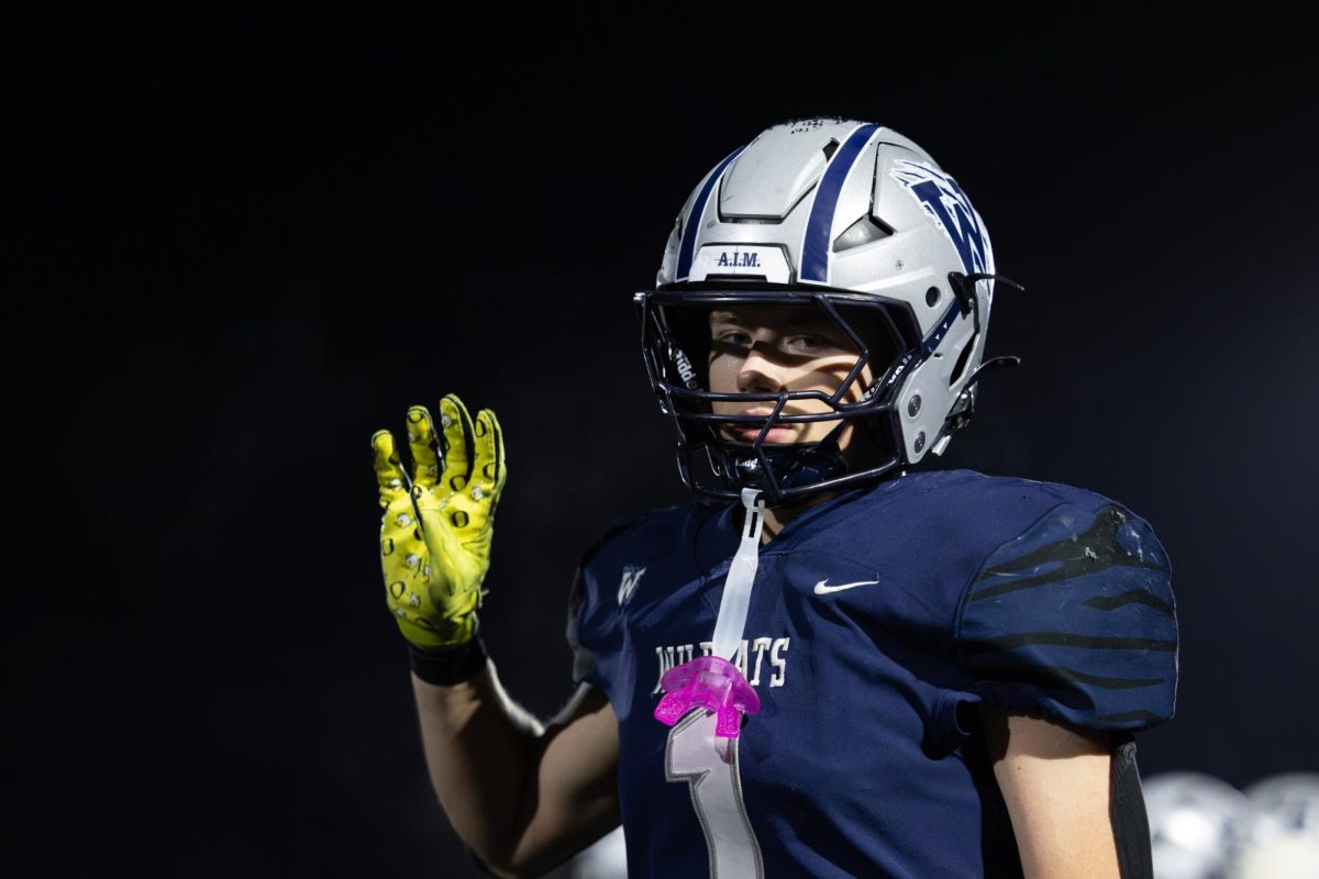 Riddick Molatore puts up a four. It's a Wilsonville tradition to put up a four when a team enters the fourth quarter.
