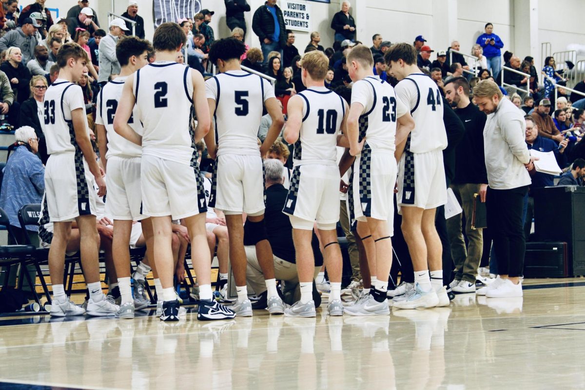 Wilsonville in the huddle during the timeout period discussing game plan and playing together as a unit. Wilsonville last season recorded a 27-4 record 1st in there division.