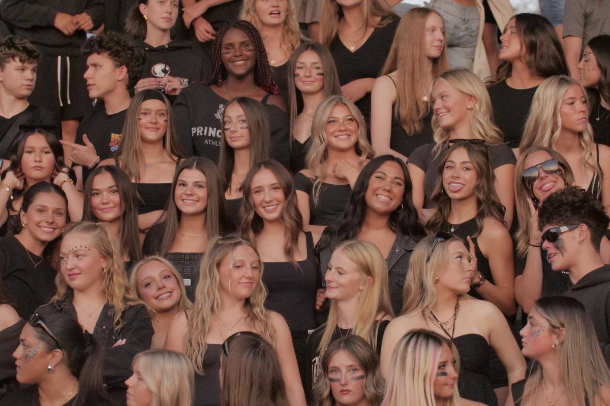 Students at Wilsonville High School dress in dark clothing while participating in a themed football game. Especially during game time, students disconnect to reconnect with one another. The use of digital cameras has sky-rocketed, in lou of utilizing cell phones. 