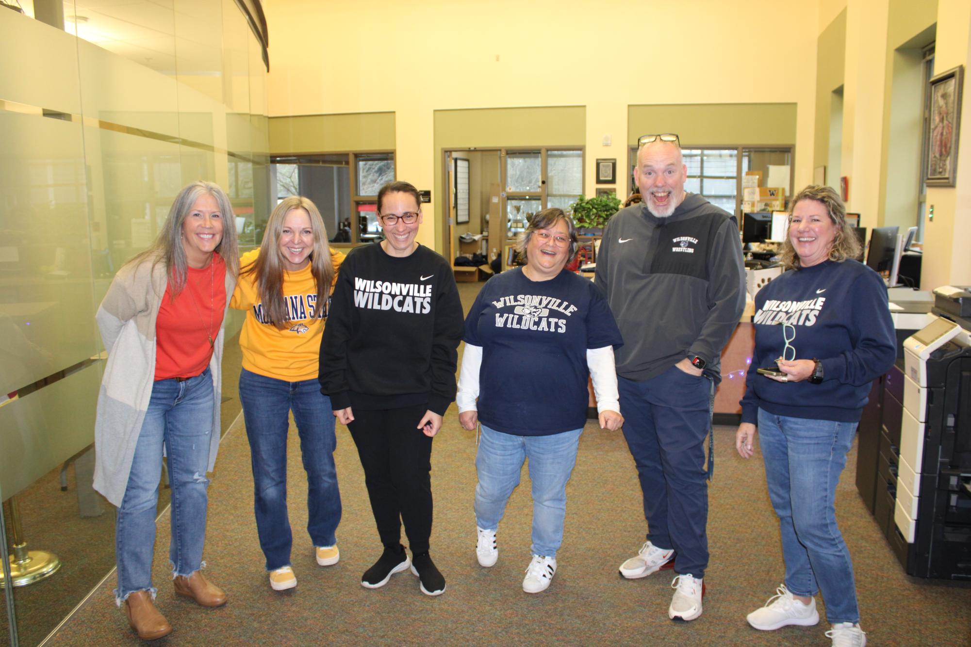 Six faculty member come together for a joyful picture in the main office. Whether it's rain or shine, Wilsonville administrators show up, happy to be a part of the Wildcat family. 
