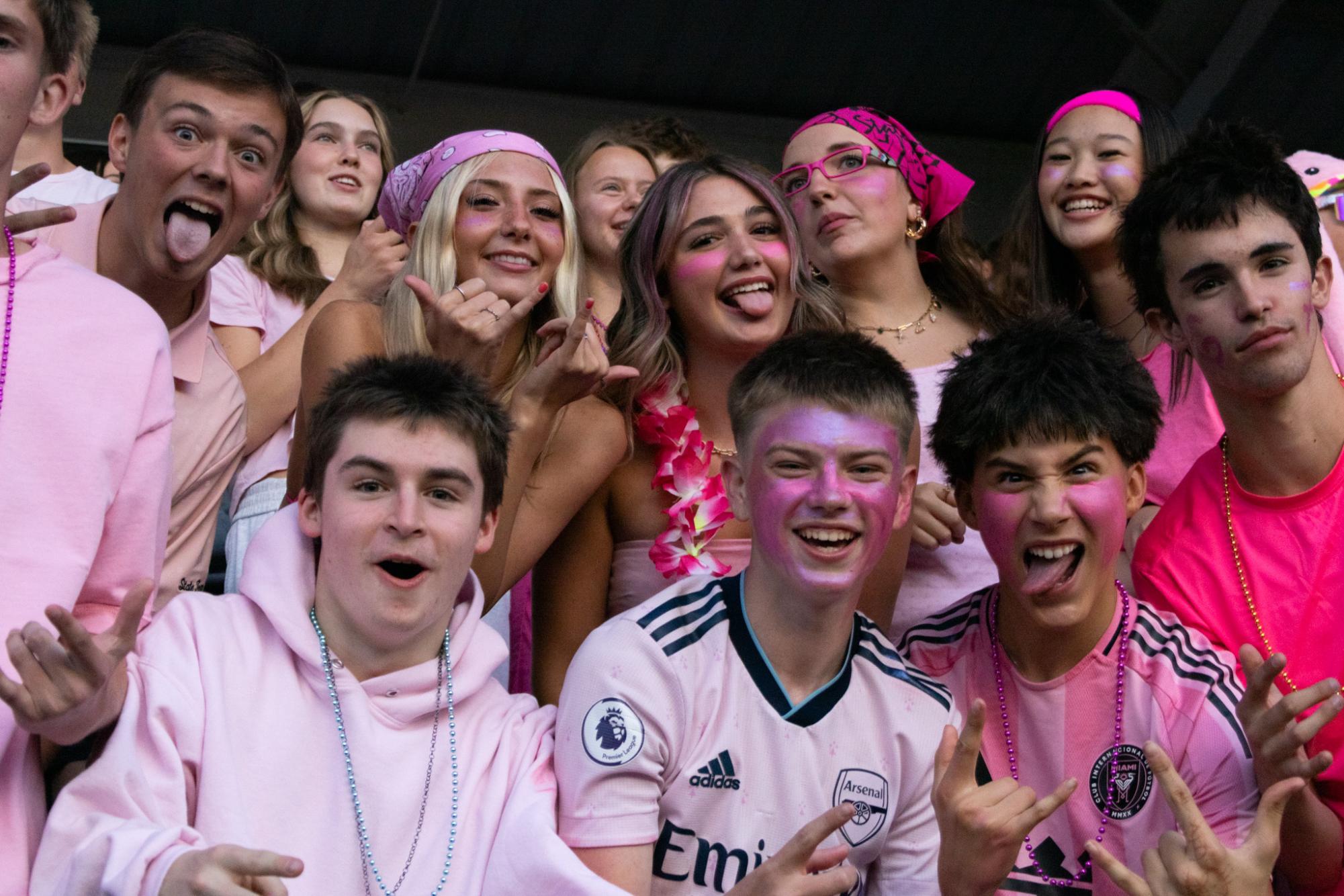 Senior students of Wilsonville pile in the first rows of the football bleachers to pack the homecoming game. Dressed down in pink, the students never come short of dressing in spirit. 