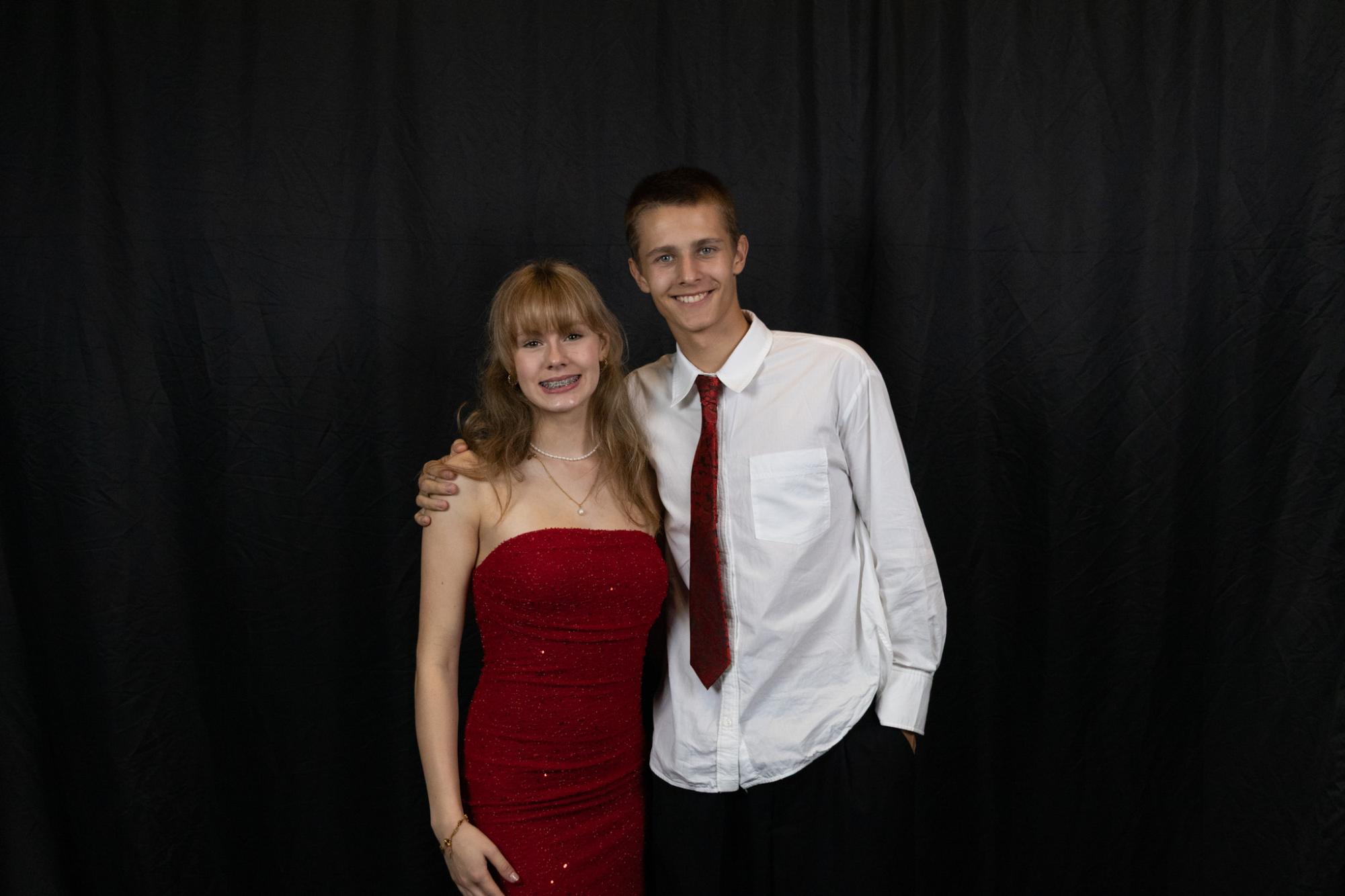 Kelsi Shivers and her date pose together for a homecoming picture. Early to the dance, couples and friend groups were able to be photographed in their formal attire. 
