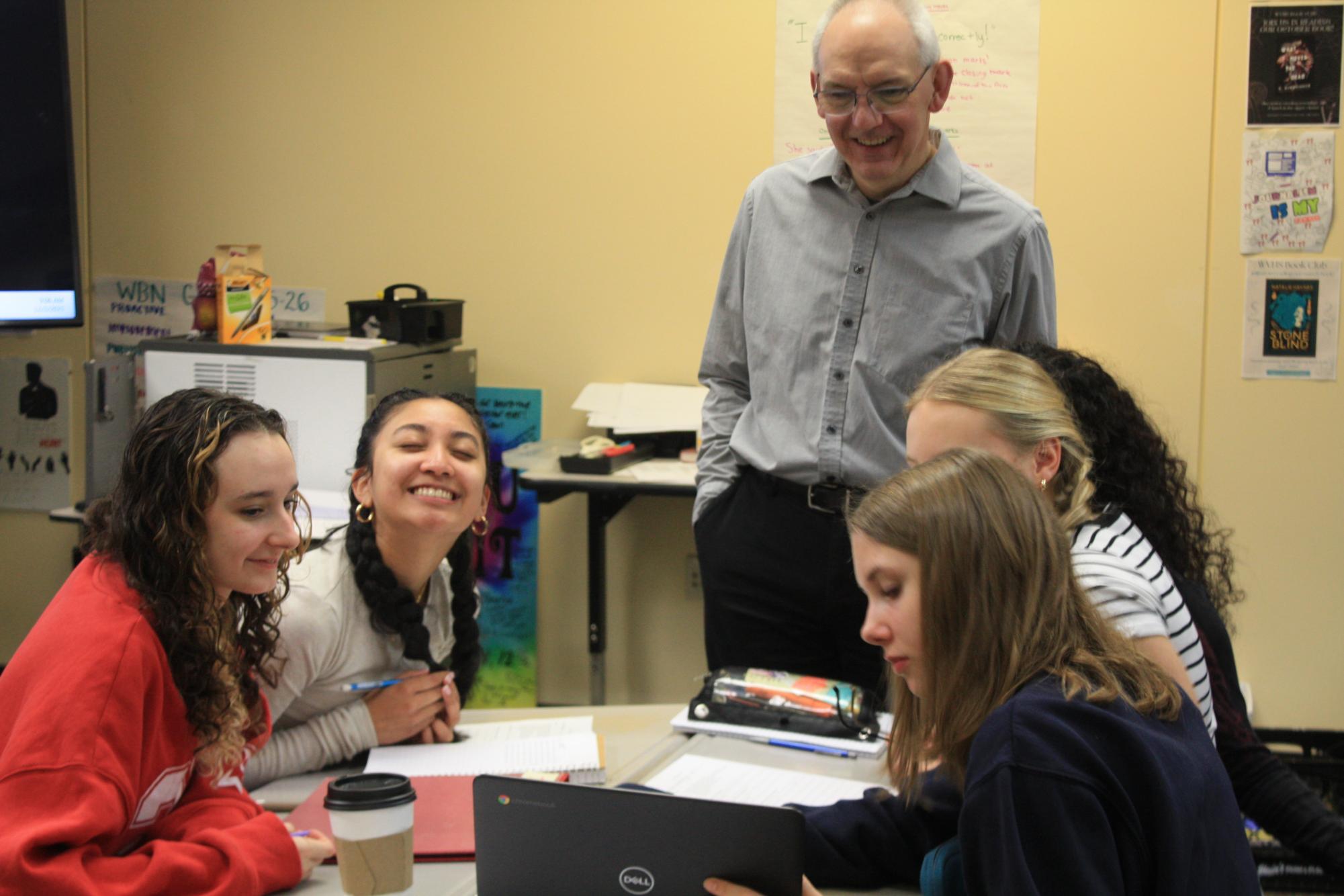 Mr. Fitz is pictured with some of his students as he prepares them for finals. He teaches both Journalism classes and the AP English Language course taken by students their junior year.