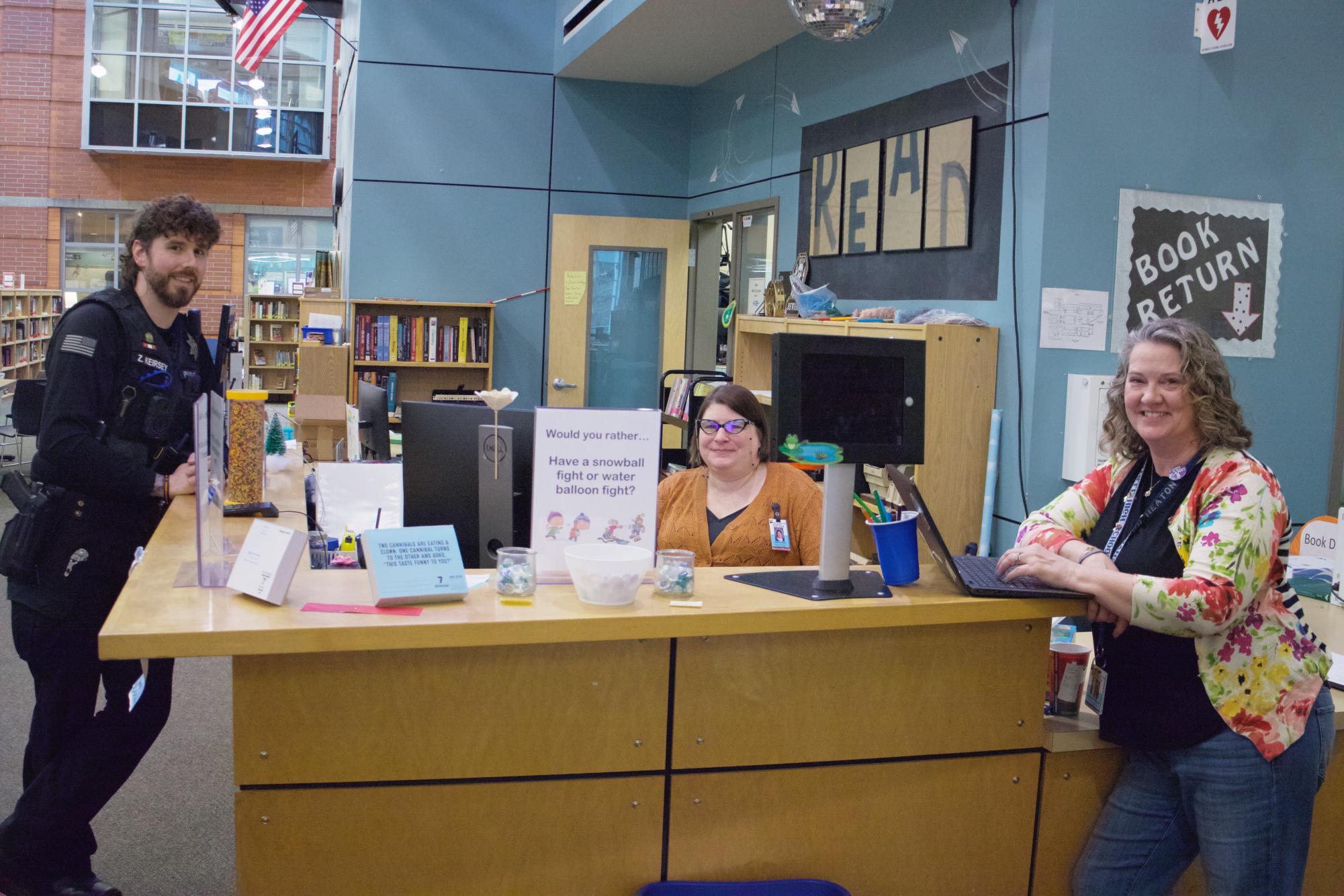 In the middle of the school, you will find the busy library where students are seen working together on projects, or teachers are seen grading papers. This photo highlights Mrs. Heaton, Mrs. Coreson, and Officer Keirsey on their break.