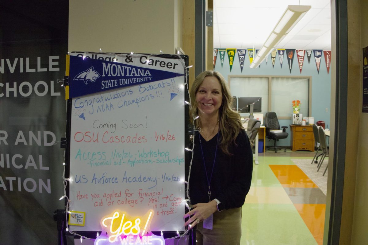 Standing next to the college and career poster is Mrs. Giese, who welcomes everyone in with her brightly colored sign. She is hard to work, as she prepares all seniors for their future plans in life after High school.