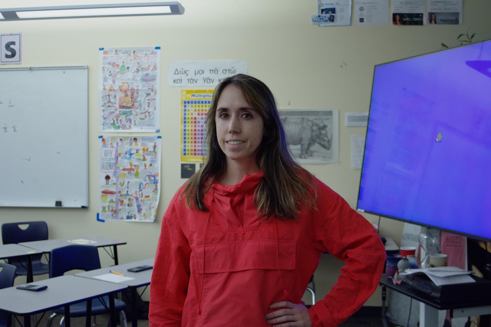 Pre-Calc teacher Mrs. Rashcko poses for a photo in front of her classroom, as her class takes a quick break between learning material. She teaches math, topics that push students to the best of their abilities, and gets them ready for the AP test In may.