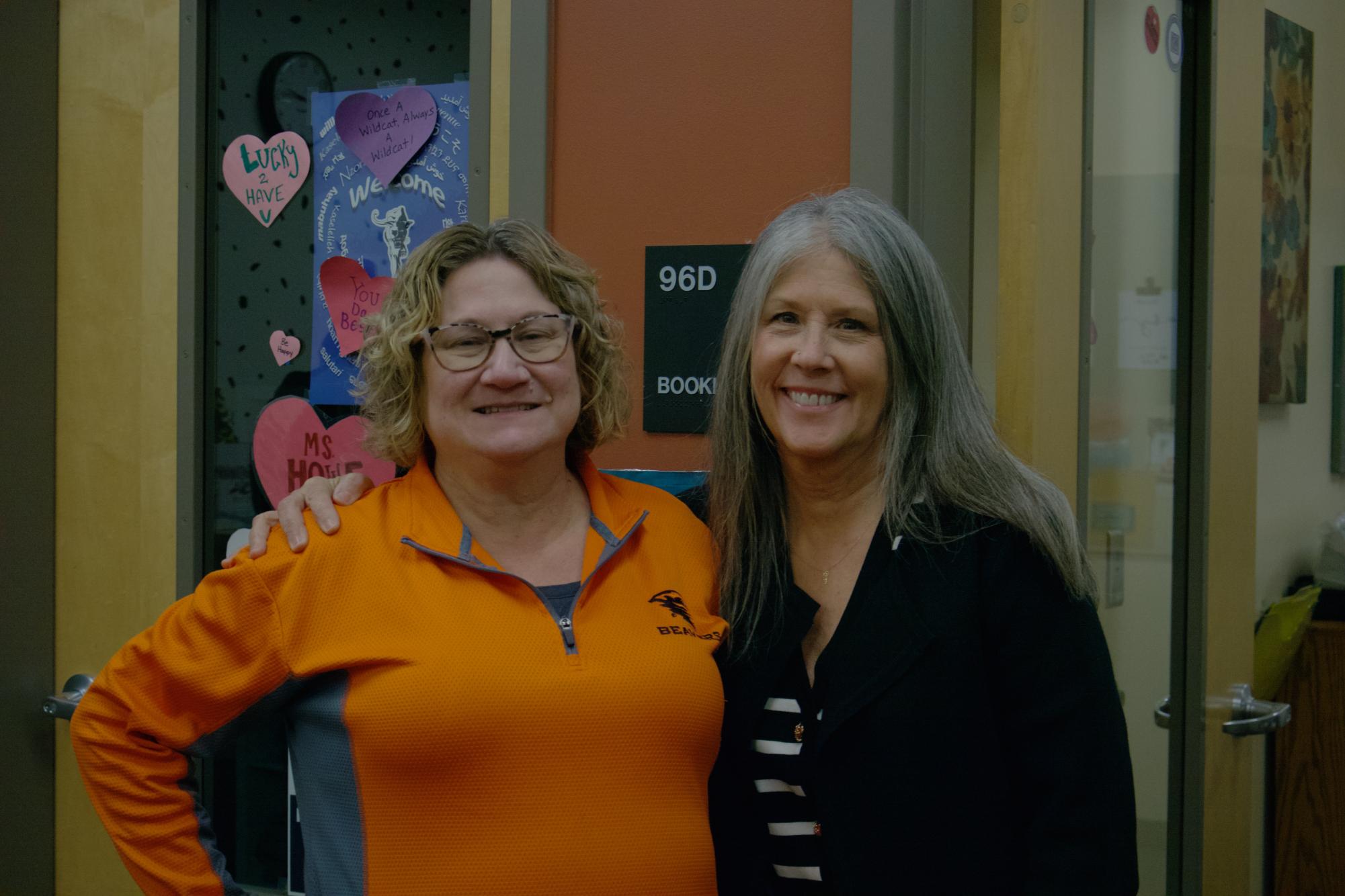 Staff members Mrs. Gunter and Mrs. Stoneking smile together in the front offices. You can always spot them at the front of the school in the main office surrounded by other faculty and staff.