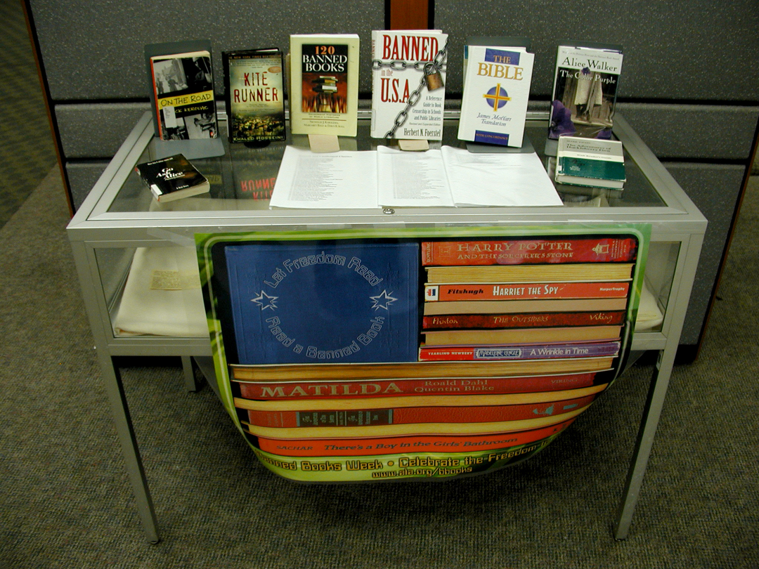 This banned book desplay shows multiple titles of books that have been banned in the past, including Alice Walker's The Color Purple.