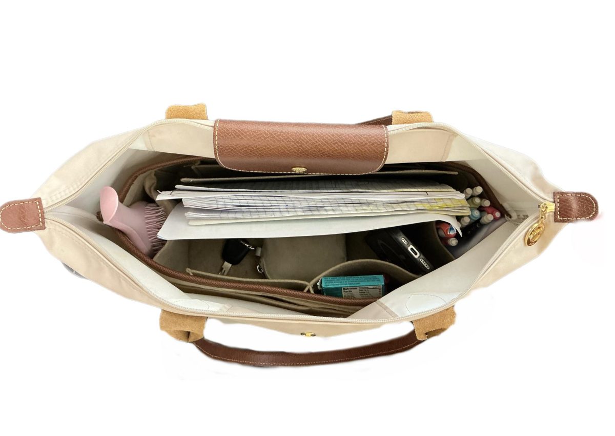 Starting off strong, our first bag is very well organized and contains items such as pens, paper, keys, and gum, which is very much needed for the day. 