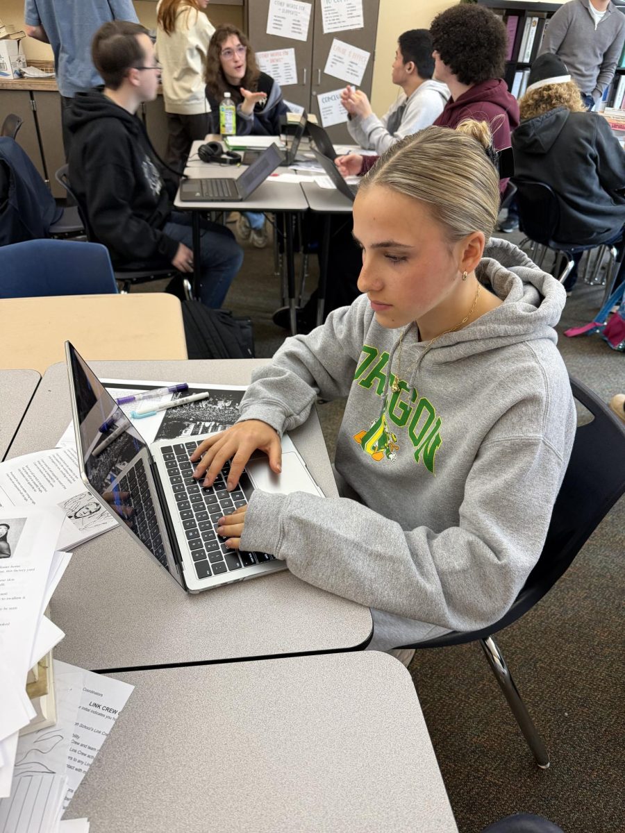 Senior Evie Dunn uses are computer to finish her assignments. She prefers typing to be faster than writing her thoughts down on paper.