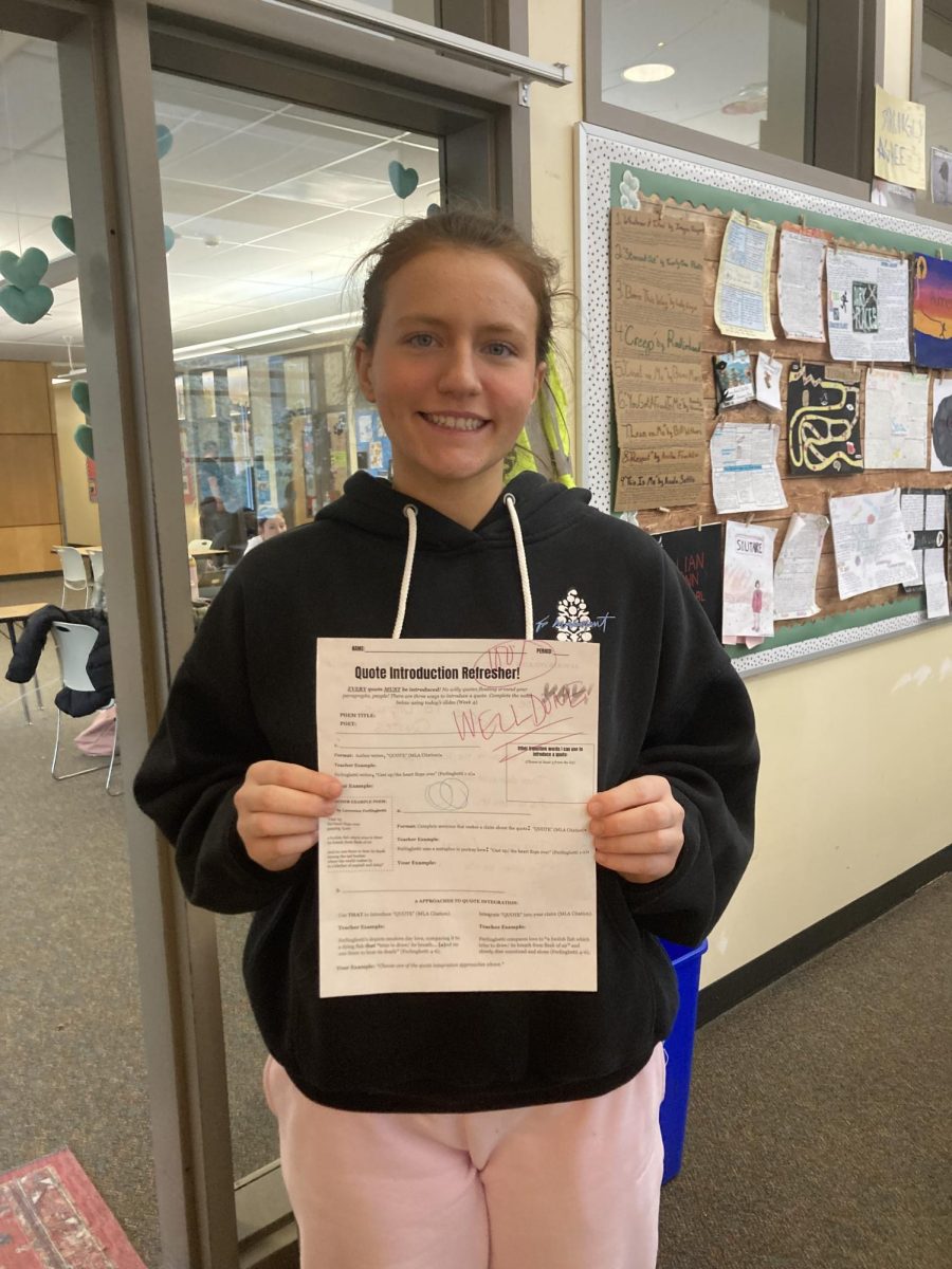 Showing that hard work pays off, Zoey Carlson smiles proudly after getting her test back. She had studied and done lots of homework to feel prepared for this test. 