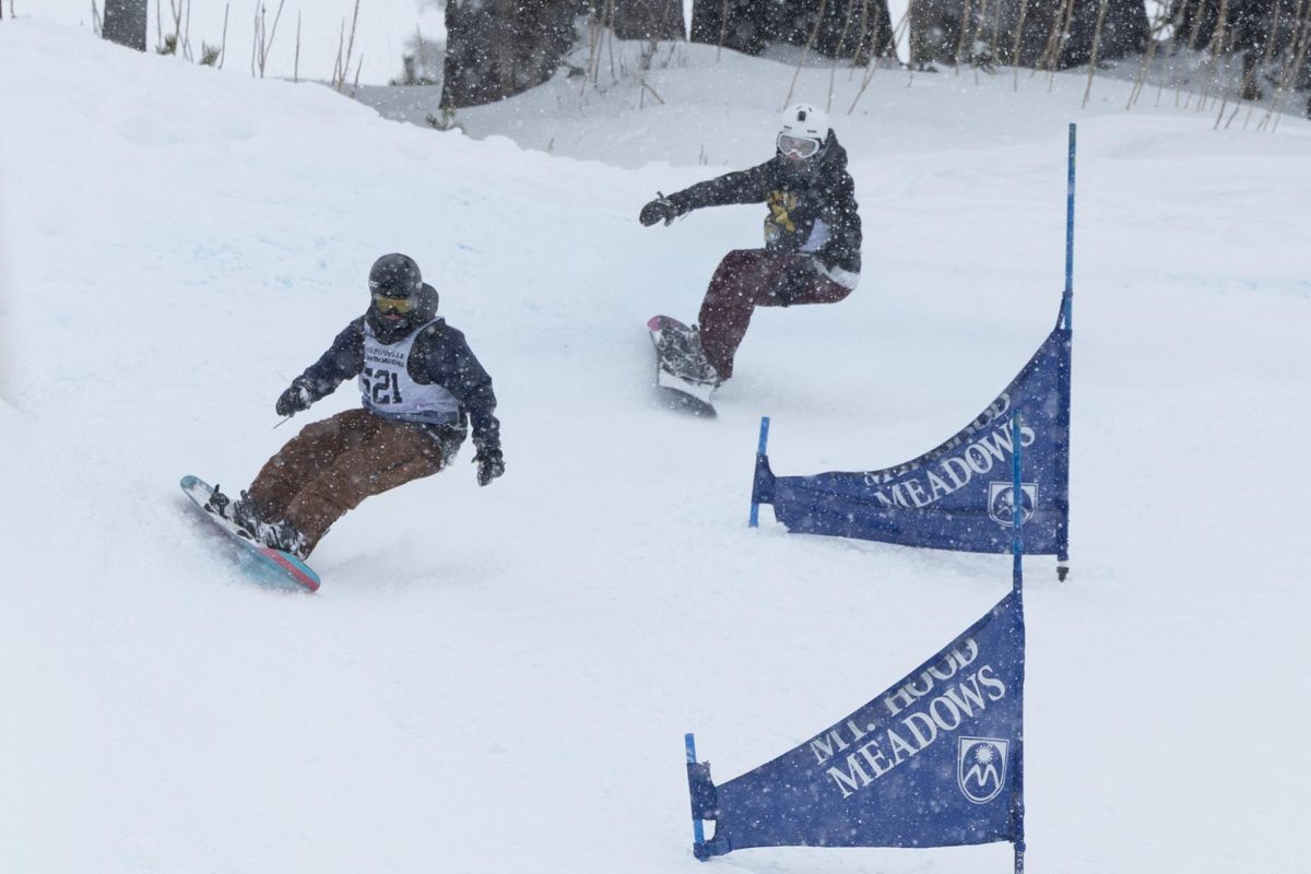 Emery shoots past an opponent with immense speeds in the Mount Hood Meadows tournament during the banked slalom course with riders competing for the fastest time possible with the best moves.