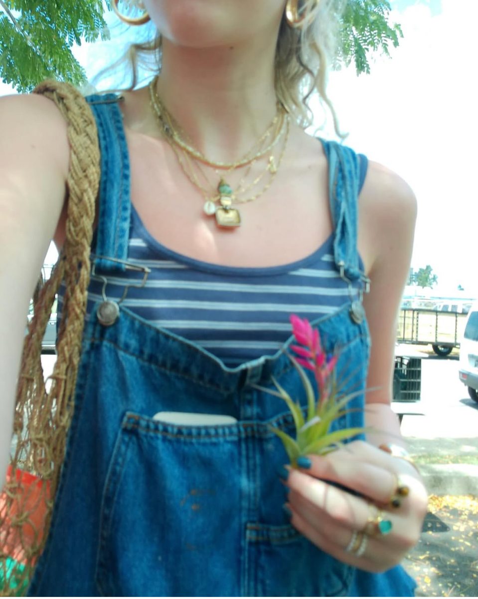 Ellie Shimmon showcases her unique style with layered gold necklaces and rings, some pieces even have hints of turquoise. Nowadays, over half of the jewelry she wears is hand-crafted.

