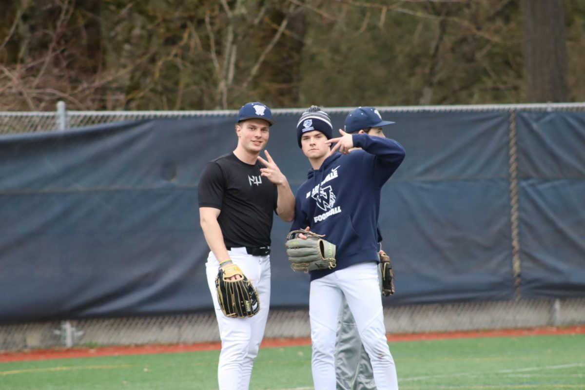 Carson Zellick and Brayden Arsenault pose for the camera in the outfield. Both players were on Junior Varsity last season and are vying for spots in the outfield.