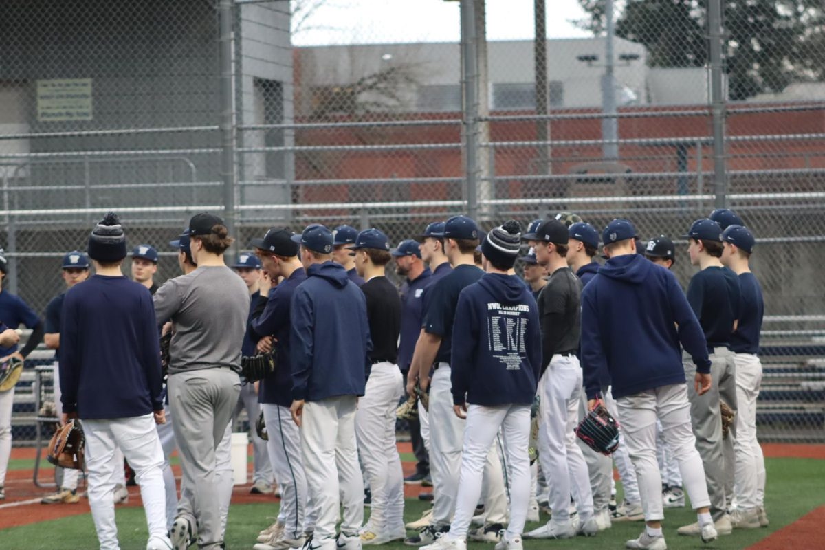The baseball team meeting up on the varsity field before baseball tryouts get underway with encouraging words from the coaches during day two of five of the baseball tryouts. Tryouts run from 3:30pm to 5:45pm.