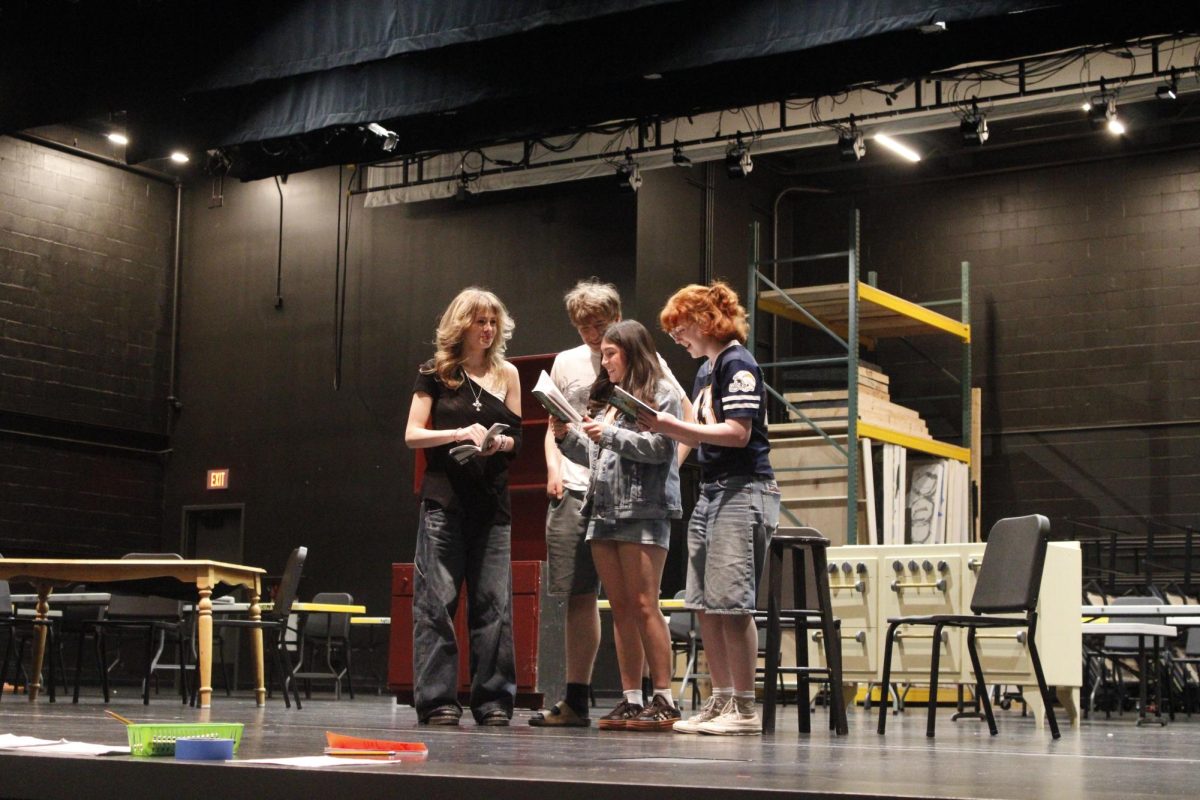 Wilsonville High school actors  (Kelsi Shivers, Abe Peykanu, Sophia Petshow, Taylor Nichols) dive into the world of “Anne of Green Gables,” at rehearsals in the PAC. With scripts in hand, and dedication in mind, their preparation for this upcoming performance is immersive. 