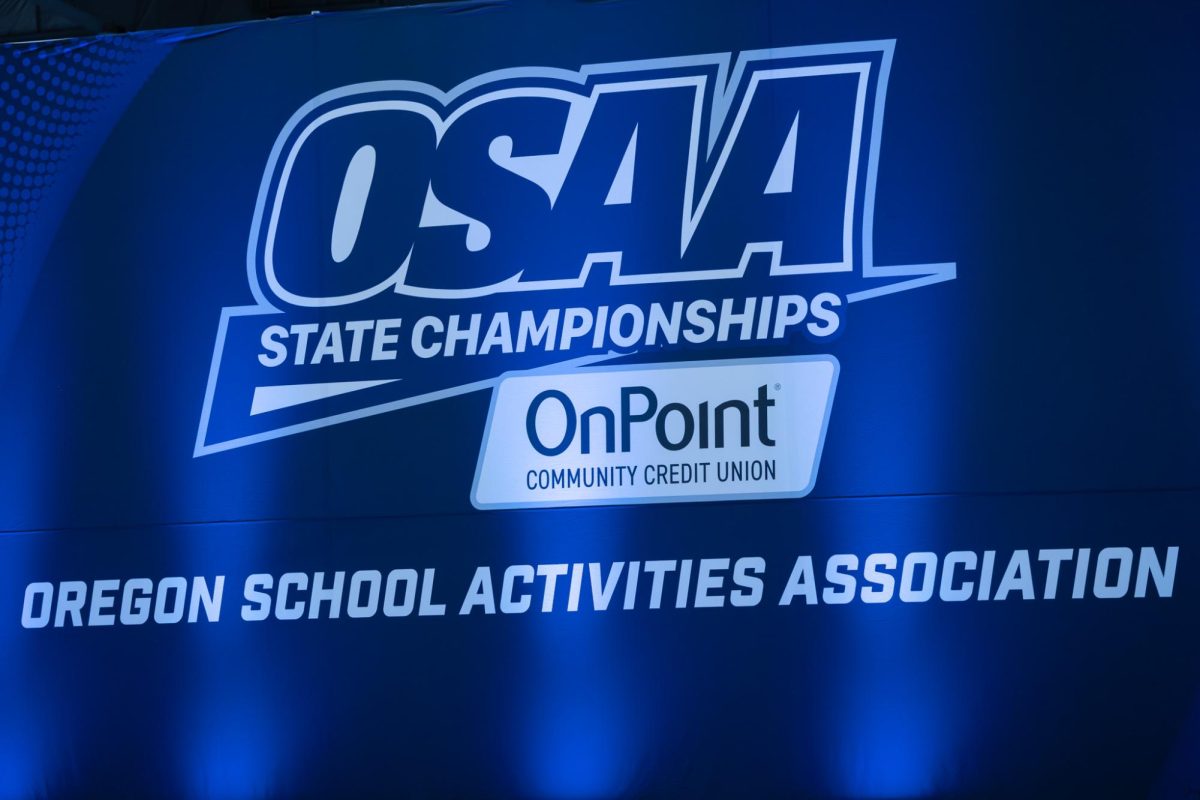 The OSAA State Championships banner behind the main stage. OSAA has had Dance/Drill as a sport for over 30 years.
