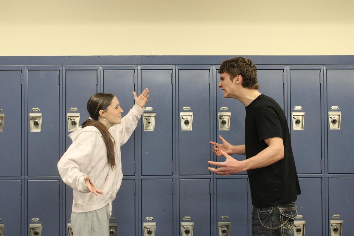 Seniors Brooklynn Rhodehammel and Reeve Schroeder have a heated argument in front of the lockers in the cafeteria. These students should learn to take more nuanced perspectives, and listen to each other's arguments. 
