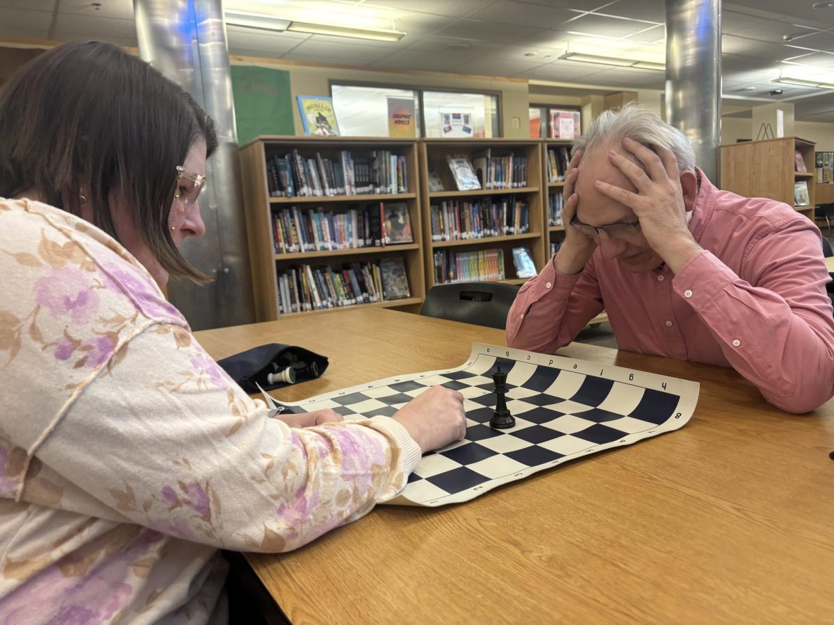 John Fitzgerald and Kate Coreson have a difficult chess match in the WVHS library. Chess is mental gymnastics. 
