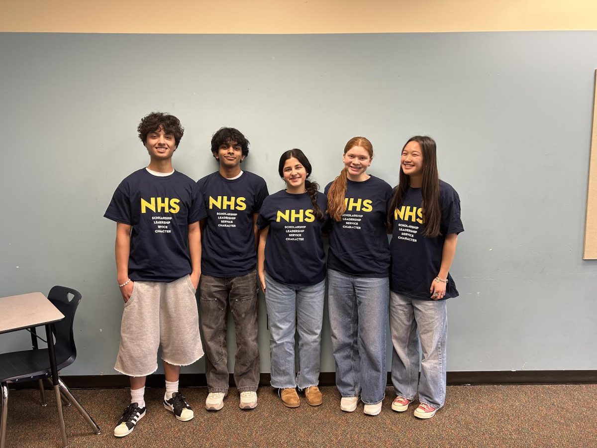 2025-26 NHS Officers wearing their NHS T-Shirts. These officers have many duties such as leading meetings or finding volunteer opportunities for the members.