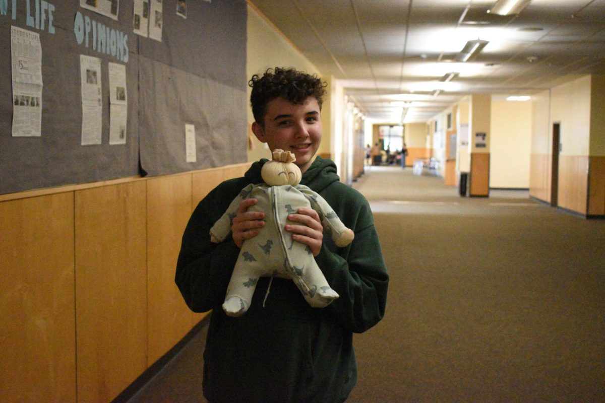Junior Jack Levesque, posing with his flour baby in the empty halls. The project has been nothing but fun for him. 