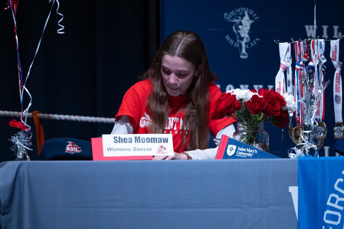 Shea Moomaw signs her letter of intent. She will go on to play soccer at St. Mary's University of Minnesota next school year.