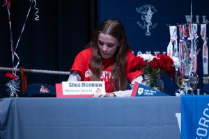 Shea Moomaw signs her letter of intent. She will go on to play soccer at St. Mary's University of Minnesota next school year.