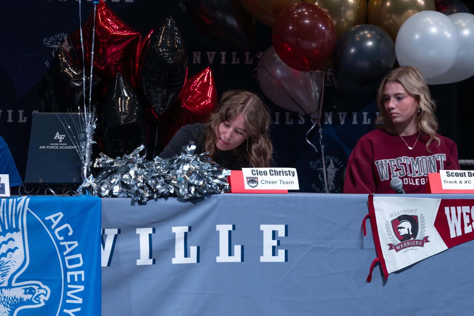 Cleo Christy signs her letter of intent. She will attend Western Oregon University next school year
