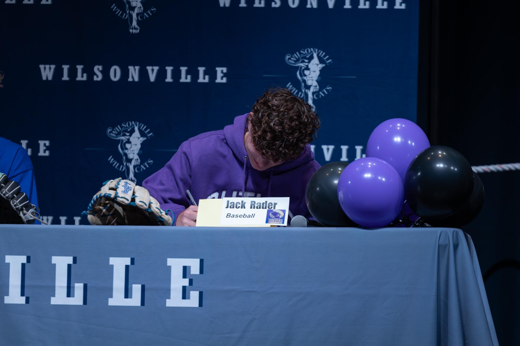 Jack Rader signs his letter of intent. He will attend Butler Community College next school year.