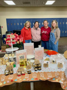 This is a photo from  the bake sale they hosted at the Holiday Market back in November. They raised money for Grad Night by securing family and community sponsorships, selling poinsettias, a 50/50 raffle at home football games, fundraising dinners at local restaurants and through ticket and yard sign sales
