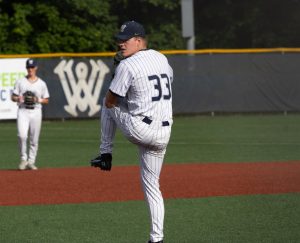 Senior pitcher Grady Weise lifts his leg, before delivering a pitch against La Salle. Grady threw 4.3 innings in relief in the loss against Central, striking out 3, only giving up 3 hits, and giving up no runs..